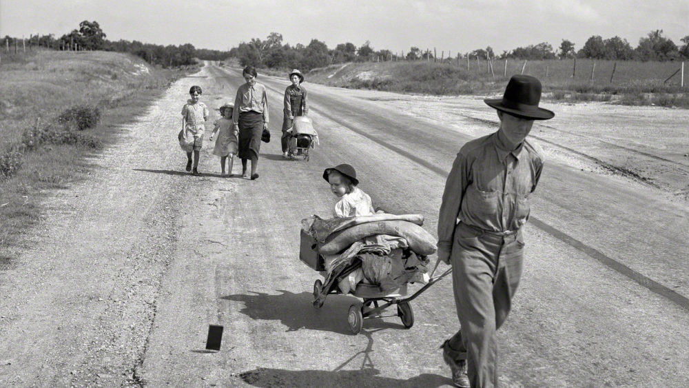 During her assignment as a photographer for the Works Progress Administration (WPA), Dorothea Lange documented the movement of migrant families forced from their homes by drought and economic depression. This family was in the process of traveling 124 miles by foot, across Oklahoma, because the father was unable to receive relief or WPA work of his own due to an illness. Dorothea Lange, “Family walking on highway, five children” (June 1938) Works Progress Administration, Library of Congress. 