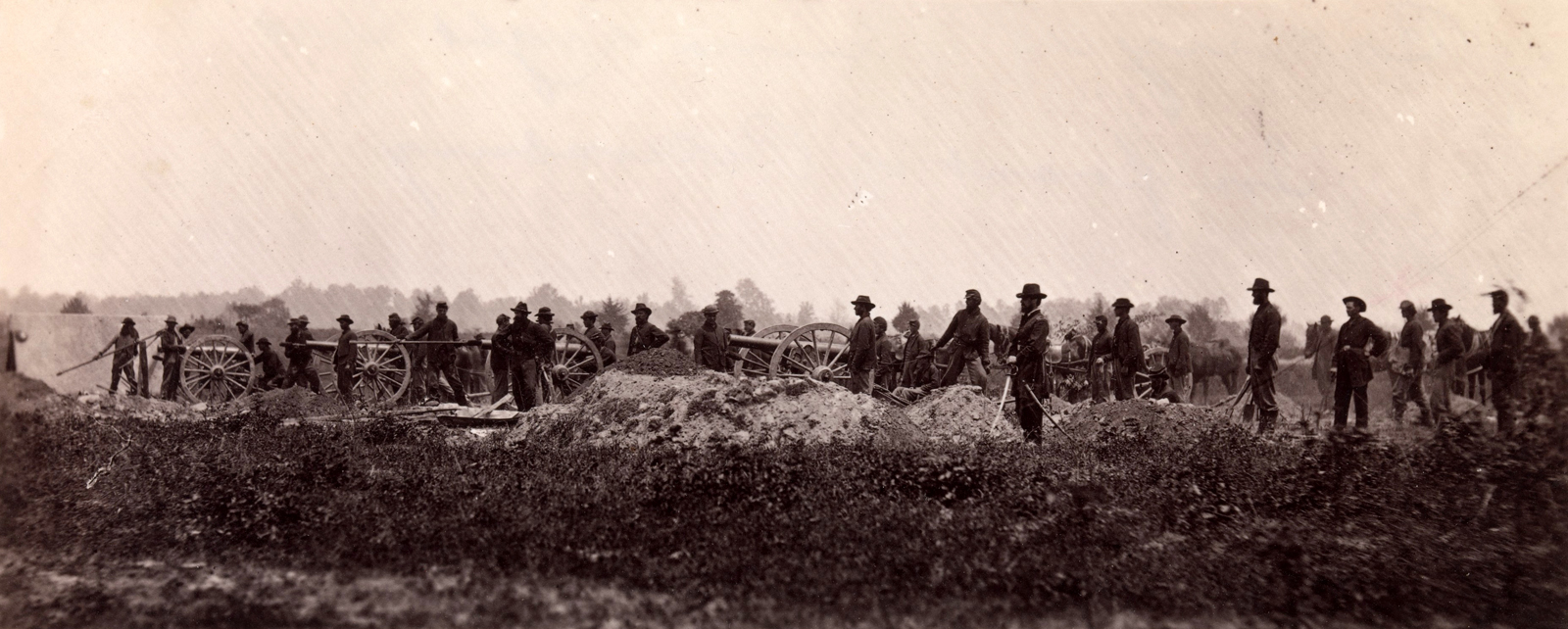 This photograph shows the men and cannons of the Pennsylvania Light Artillery, in 1864.