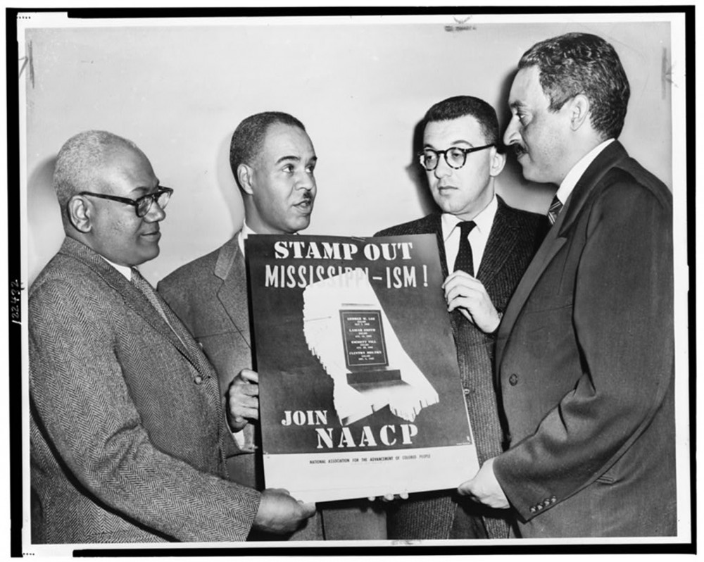 NAACP leaders, including Thurgood Marshall (who would become the first African American Supreme Court Justice), hold a poster saying "Stamp out MIssissippi-ism! Join NAACP"