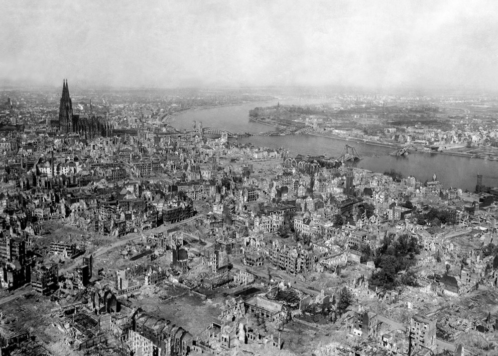 Bombings throughout Europe caused complete devastation in some areas, leveling beautiful ancient cities like Cologne, Germany. Cologne experienced an astonishing 262 separate air raids by Allied forces, leaving the city in ruins as in these the photograph above. Amazingly, the Cologne Cathedral stands nearly undamaged even after being hit numerous times, while the area around it crumbles. Photograph, April 24, 1945. Wikimedia, http://commons.wikimedia.org/wiki/File:Koeln_1945.jpg.