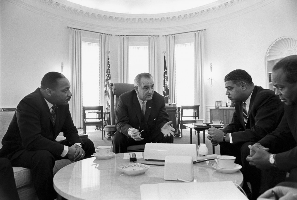 Photograph of Lyndon B. Johnson sitting with Civil Rights leaders in the White House including Martin Luther King Jr.