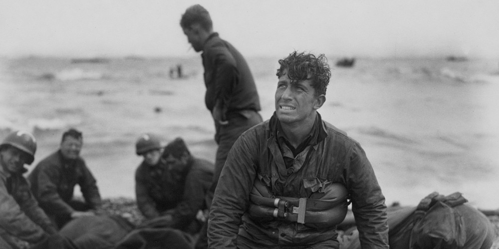 A photograph of American soldiers on Omaha Beach after D-Day. 