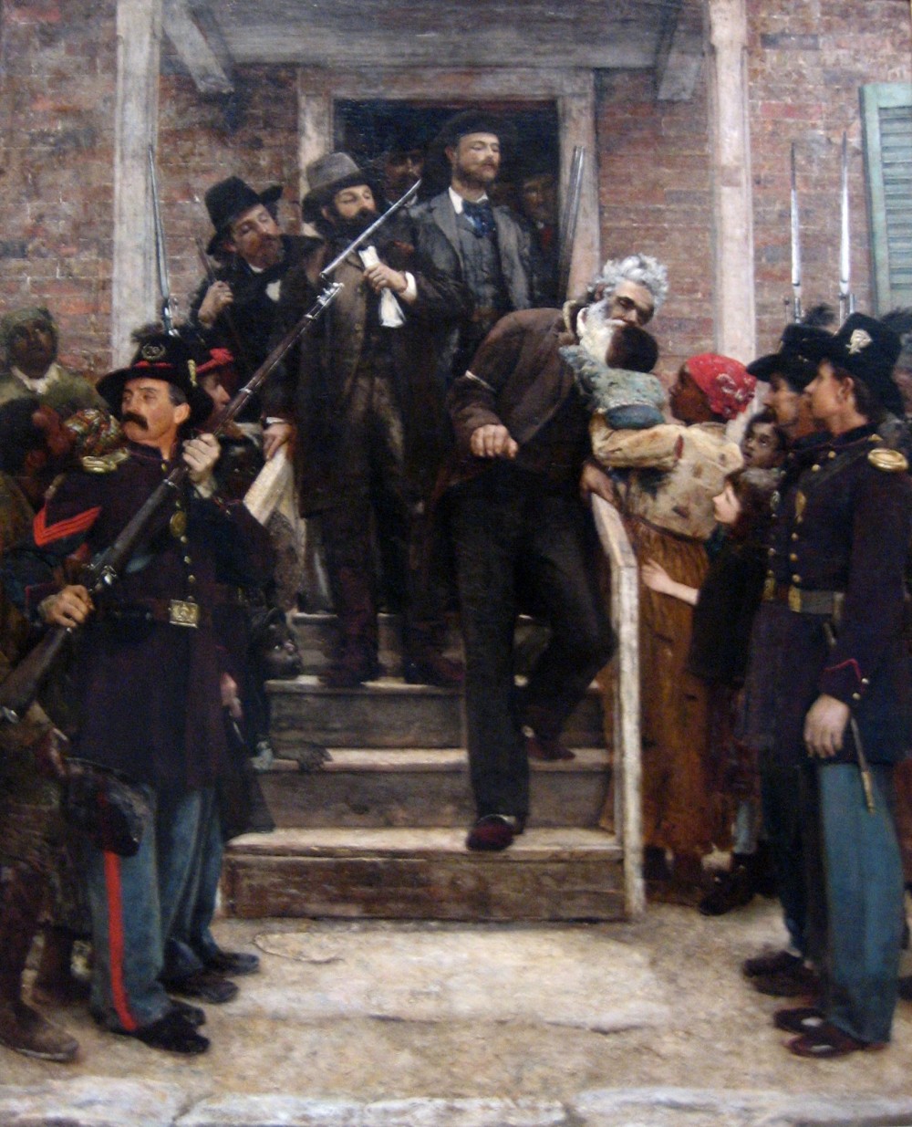 The execution of John Brown made him a martyr in abolitionist circles and a confirmed traitor in southern crowds. Both of these images continued to pervade public memory after the Civil War, but in the North especially (where so many soldiers had died to help end slavery) his name was admired. Over two decades after Brown’s death, Thomas Hovenden portrayed Brown as a saint. As he is lead to his execution for attempting to destroy slavery, Brown poignantly leans over a rail to kiss a black baby. Thomas Hovenden, The Last Moments of John Brown, c. 1882-1884. Wikimedia, http://commons.wikimedia.org/wiki/File:%27The_Last_Moments_of_John_Brown%27,_oil_on_canvas_painting_by_Thomas_Hovenden.jpg. 