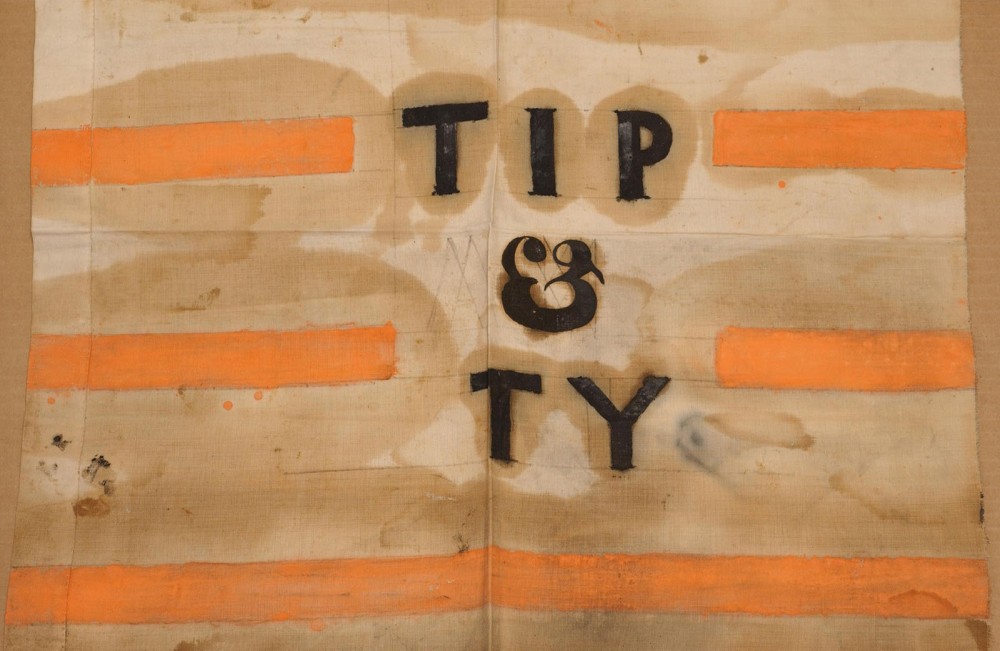 “Tippecanoe and Tyler Too” was a popular and influential campaign song and slogan, helping the Whigs and William Henry Harrison (with John Tyler) win the presidential election in 1840. Pictured here is a campaign banner with shortened “Tip and Ty,” one of the many ways that Whigs made the “log cabin campaign” successful. Wikimedia, http://commons.wikimedia.org/wiki/File:Tip_and_Ty_banner.jpg. 