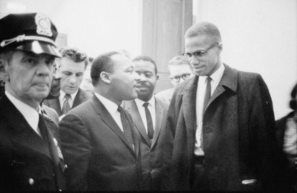 Like Booker T. Washington and W.E.B. Du Bois before them, Martin Luther King, Jr., and Malcolm X represented two styles of racial uplift while maintaining the same general goal of ending racial discrimination. How they would get to that goal is where the men diverged. Marion S. Trikosko, “[Martin Luther King and Malcolm X waiting for press conference],” March 26, 1964. Library of Congress, http://www.loc.gov/pictures/item/92522562/.