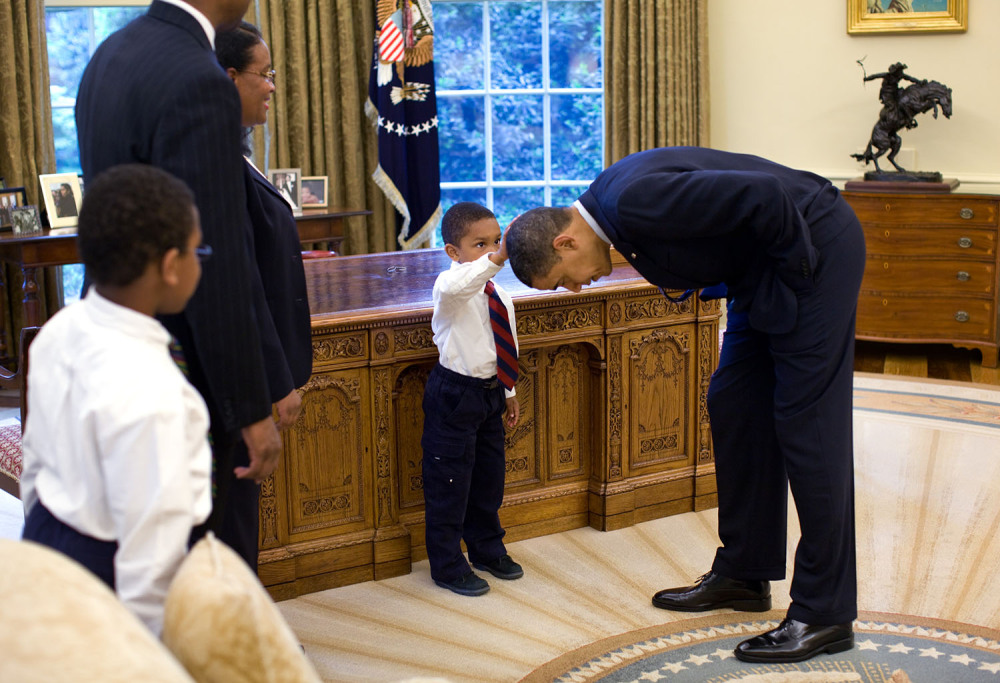 Photograph of 5-year-old Jacob Philadelphia touching President Barack Obama's hair. The child said, “I want to know if my hair is just like yours."