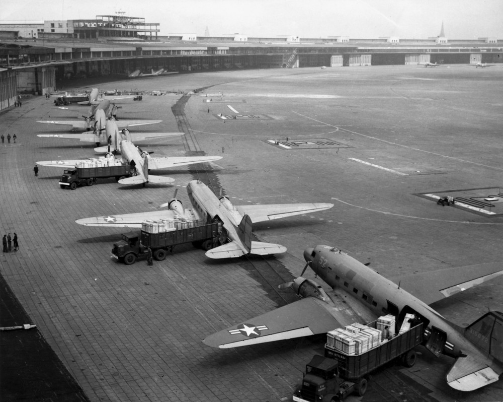 The Berlin Blockade and resultant Allied airlift was one of the first major crises of the Cold War. Photograph, U.S. Navy Douglas R4D and U.S. Air Force C-47 aircraft unload at Tempelhof Airport during the Berlin Airlift, c. 1948-1949. Wikimedia, http://commons.wikimedia.org/wiki/File:C-47s_at_Tempelhof_Airport_Berlin_1948.jpg.