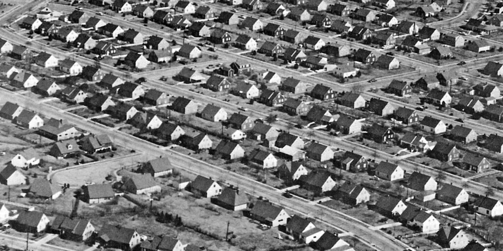 Long rows of small tract homes line multiple streets.