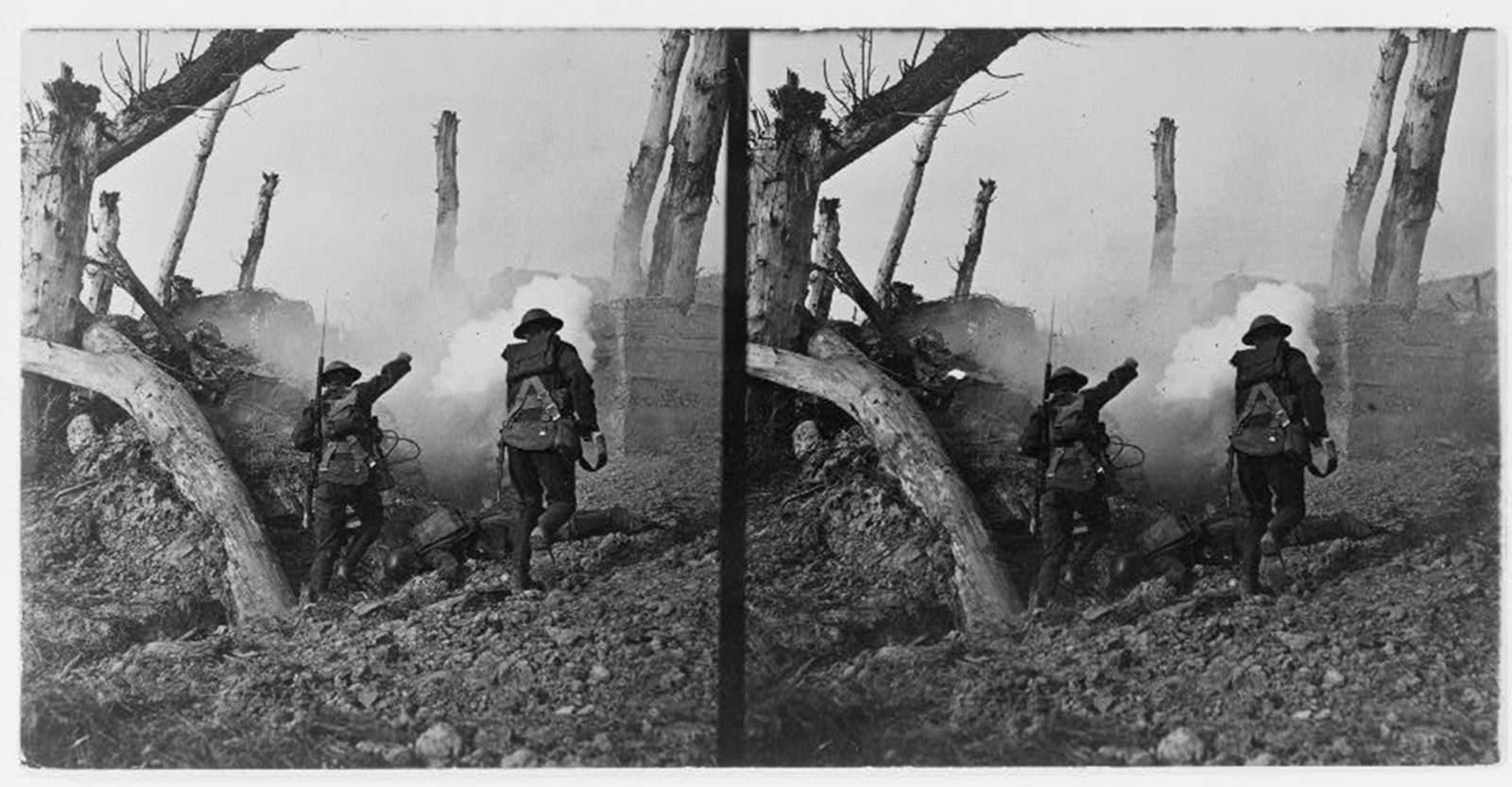 Two soldiers in a denuded landscape charge a bunker.