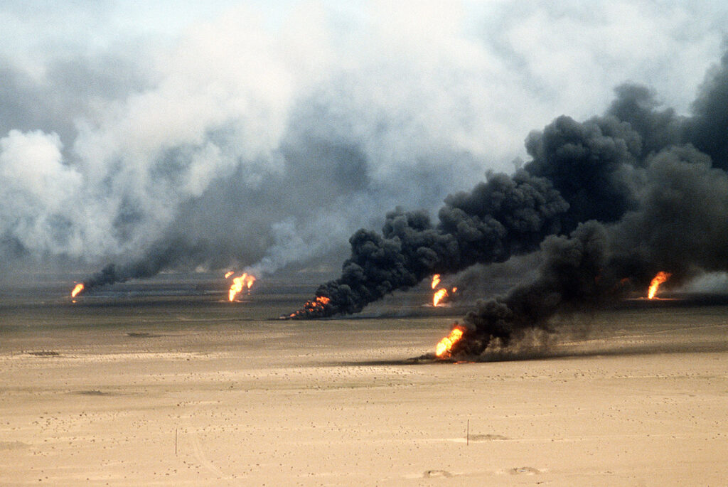 Oilfields burn in the desert. 