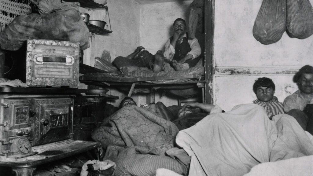 Several men resting in an overcrowded room.