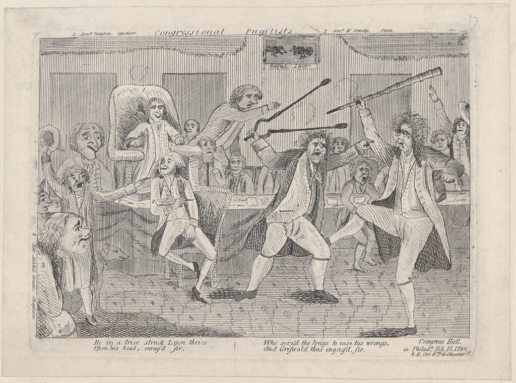 This 1798 satirical political cartoon depicts congressmen Roger Griswold, a Federalist, and Matthew Lyon, a Jeffersonian, having a physical fight in the chambers of Congress. Griswold is shown kicking and swinging a cane at Lyons, while Lyons is countering by swinging a pair of fireplace tongs back at Griswold. Several other congressmen are looking on at the two men fighting.
