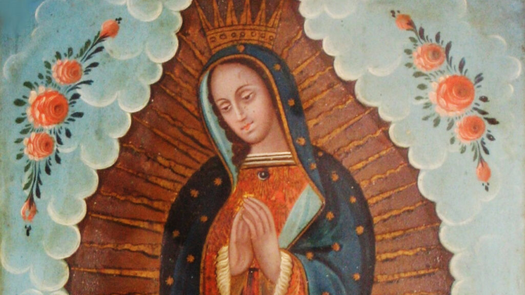 Our Lady of Guadalupe is perhaps the most culturally important and extensively reproduced Mexican-Catholic image. In this iconic image, Mary wearing a crown  serenely folds her hands and she is adorned by the tilma (peasant cloak) of Juan Diego, on which, according to his story, appeared the image of the Virgin of Guadalupe. Sun rays appear to come from her. The upper two corners are painted in a teal color and embellished with pink roses.