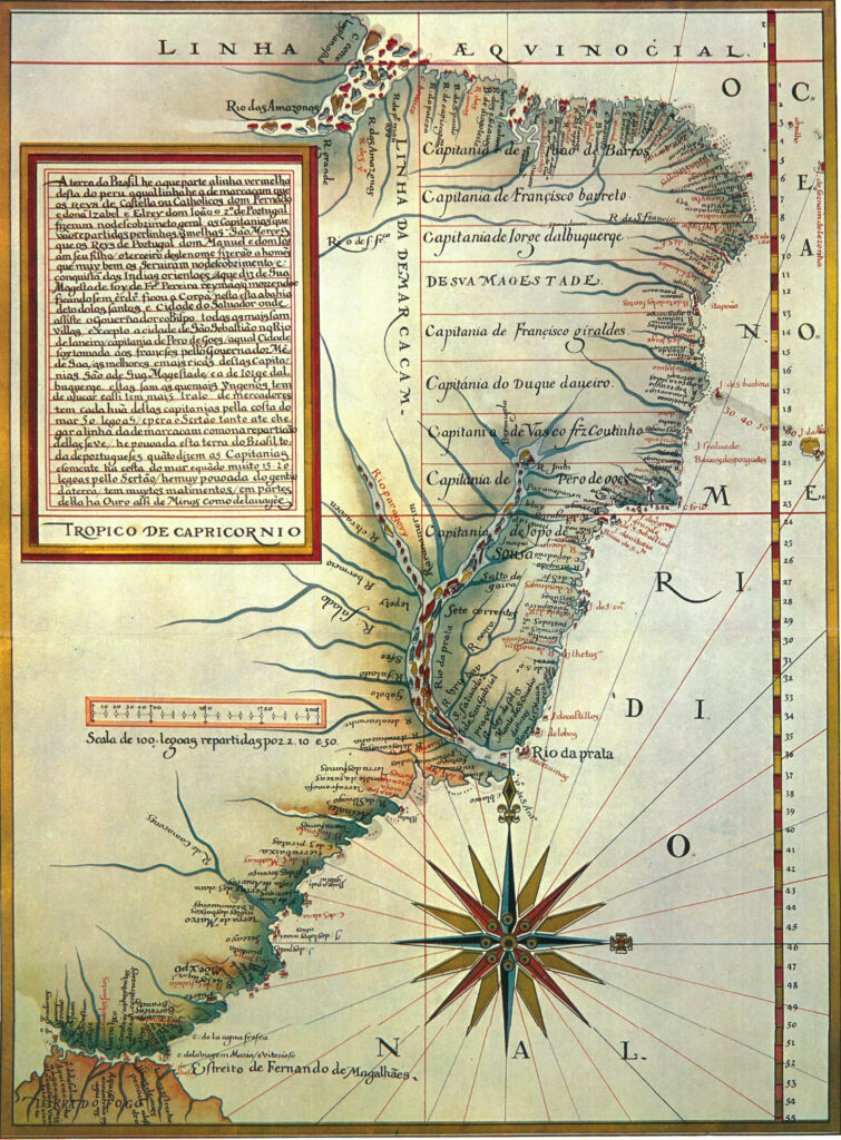 A historical map of South America, primarily focusing on the eastern coast of present-day Brazil. The map is ornately illustrated with a compass rose in the South Atlantic Ocean, latitude and longitude lines, and various geographic and political features. Notable elements include the "Linha da Demarcaçam" (Line of Demarcation) separating Spanish and Portuguese territories, the "Rio das Amazonas," and the "Rio da Prata." Several captaincies (territorial divisions) are labeled along the coastline, such as those of Vasco Fernandes Coutinho and Duarte Coelho.